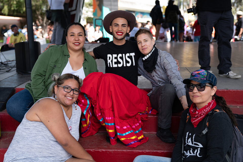 People gather in Chicano Park for the Free Our Future San Diego Action organized by Mijente and attended by a national coalition of supporters in San Diego, California on July 2, 2018. #AbolishICE #shutdownsessions #freeourfuture Las personas se reúnen en el Parque Chicano para la demostración Free Our Future, organizada por Mijente y asistida por una coalición nacional de simpatizantes en San Diego, California, el 2 de julio de 2018. Pictured at center: Alejandro Castelar of Tucson, Arizona, with the Mariposas Sin Fronteras group. Pictured with other Tucson-based activists. Photo by Angela Jimenez for Auburn Theological Seminary/Mijente