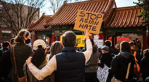 protester holding a Stop Asian Hate sign 