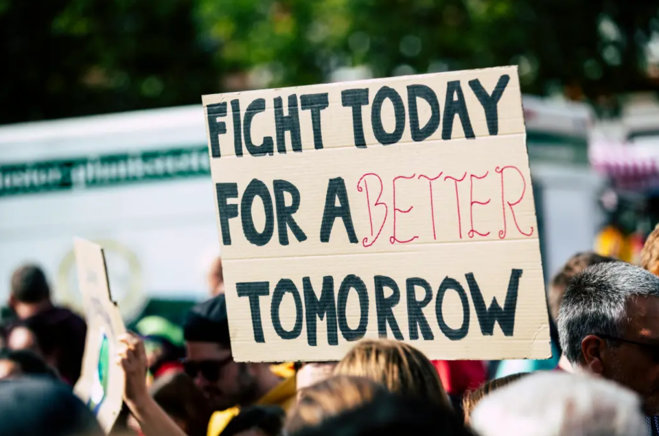 Sign reading, "Fight today for a better tomorrow."